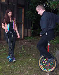 A student tries out the unicycle