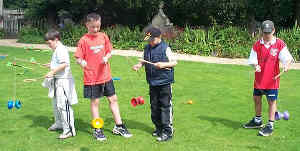 A group of lads learn the diabolo