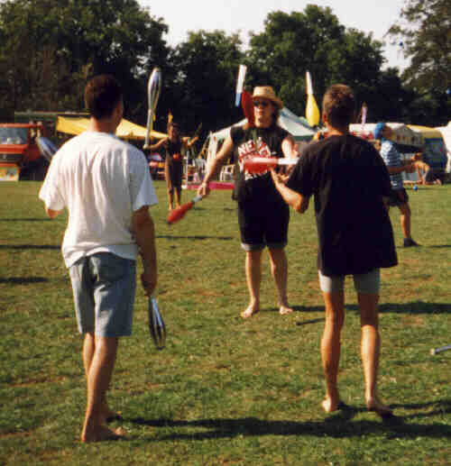 3 teenagers pass clubs together