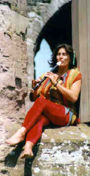 Lynne plays the recorder in the window of Ludlow Castle