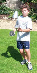 A lad uses the shaker cups in Ashton Court, Bristol