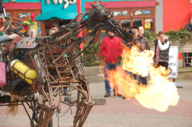 Mechanical fire breathing horse during the day