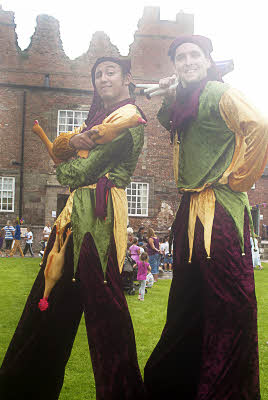 medieval jesters stilt walkers