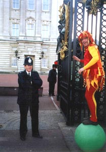 Andy Wood, on his walking globe, entertains a policeman. 