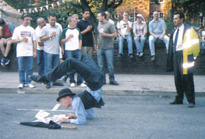 Contortionist Rubber Ritchie stops the traffic in Manchester.