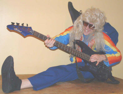 Rubber Ritchie plays bass guitar